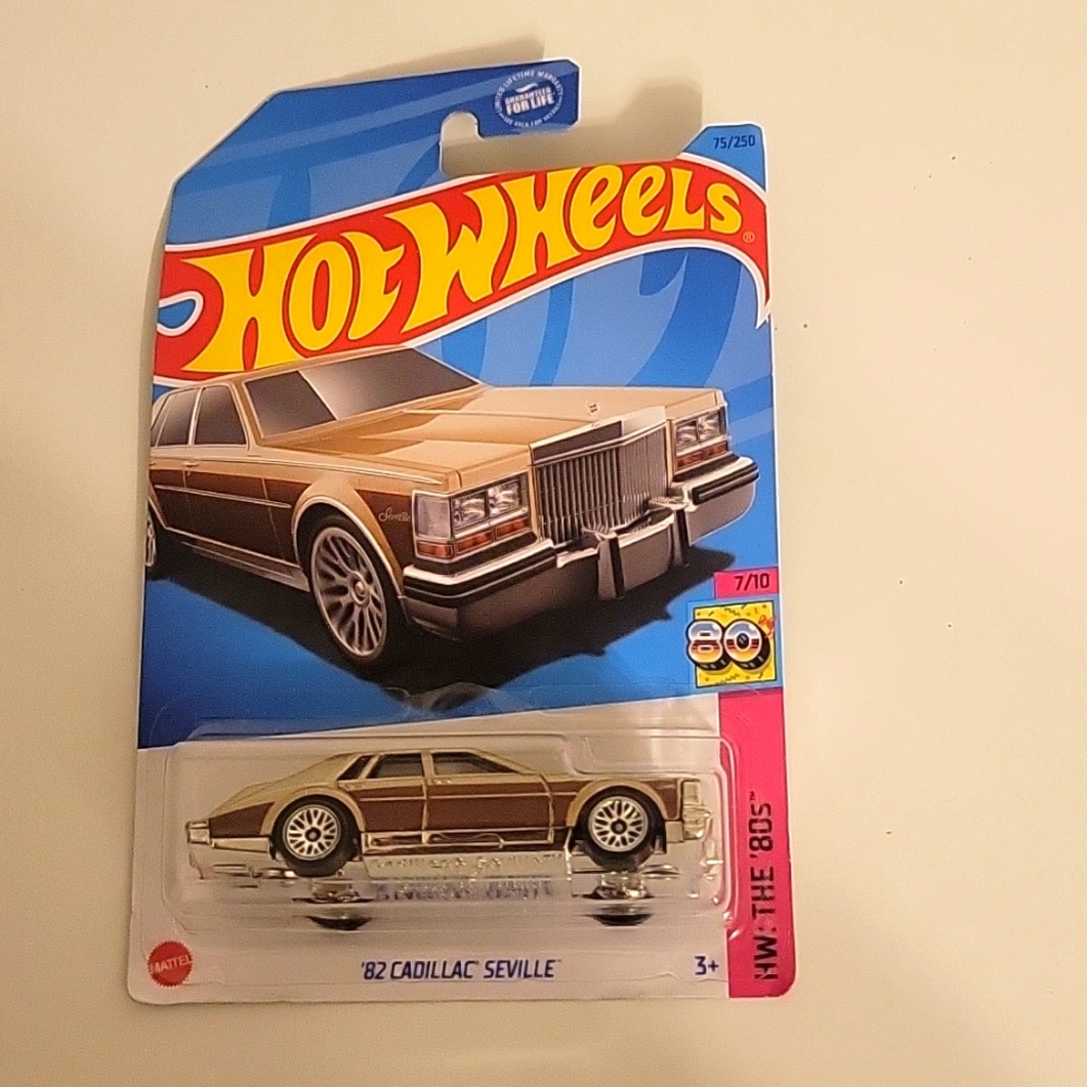 Hotwheels 82 Cadillac Seville unopened gold/brown
